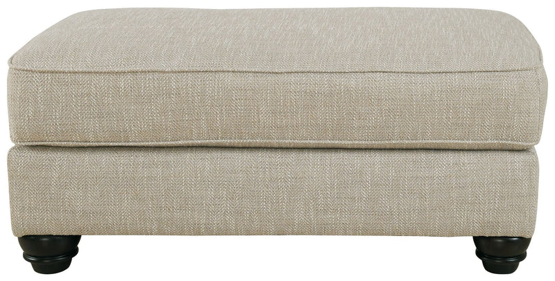 Ashley Asanti Ottoman in Fog-Washburn's Home Furnishings