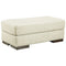 Ashley Caretti Ottoman in Parchment-Washburn's Home Furnishings