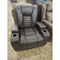 Manwah Glider Recliner w/2 Cupholders & 2 Storage Consoles Ribbed Stitching in Brown Vinyl-Washburn's Home Furnishings